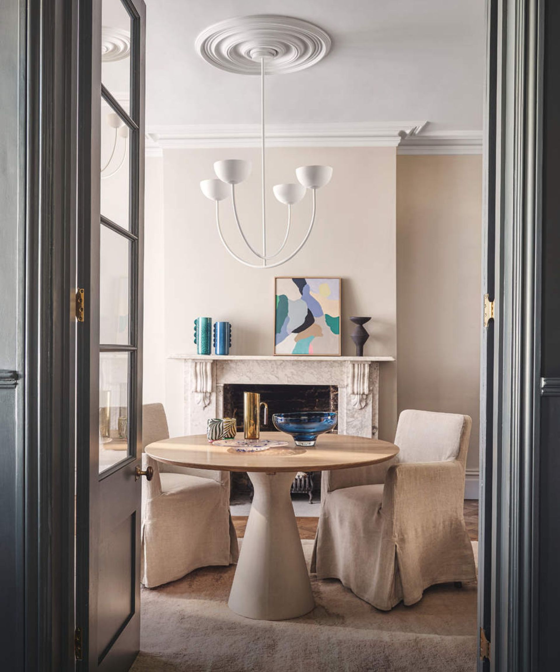 Beige dining area, fireplace, round table