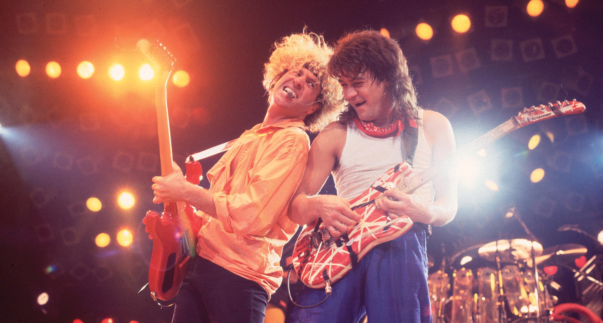 Sammy Hagar and Eddie Van Halen jam it out onstage as Van Halen perform live in 1986