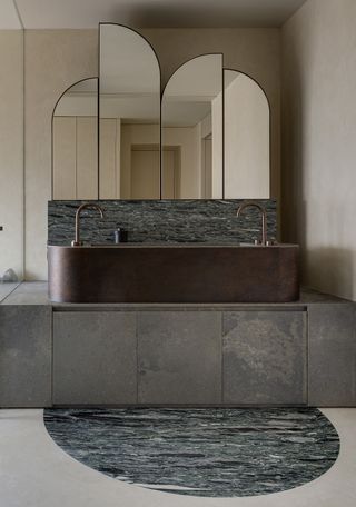 A bathroom with marble flooring