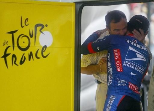 Bernard Hinault congratulates Lance Armstrong on winning the 2003 Tour de France