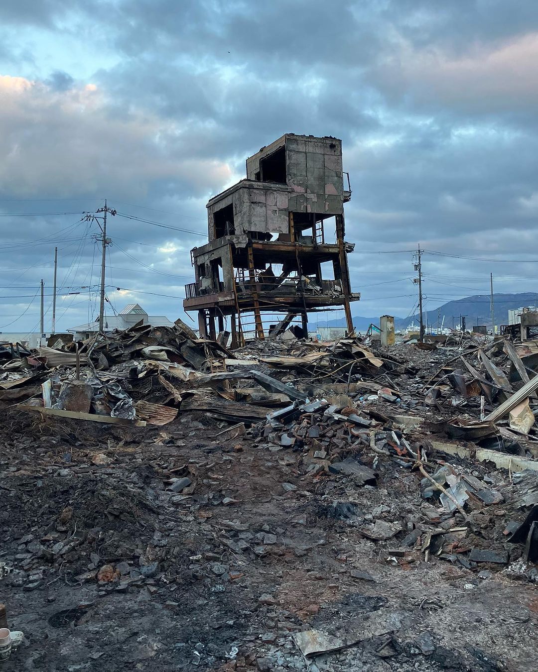 Single building standing in Wajima morning market area in destruction post-earthquake