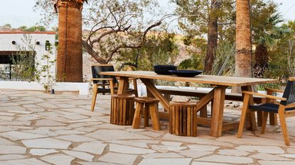 an outdoor dining table at a home by bobby berk