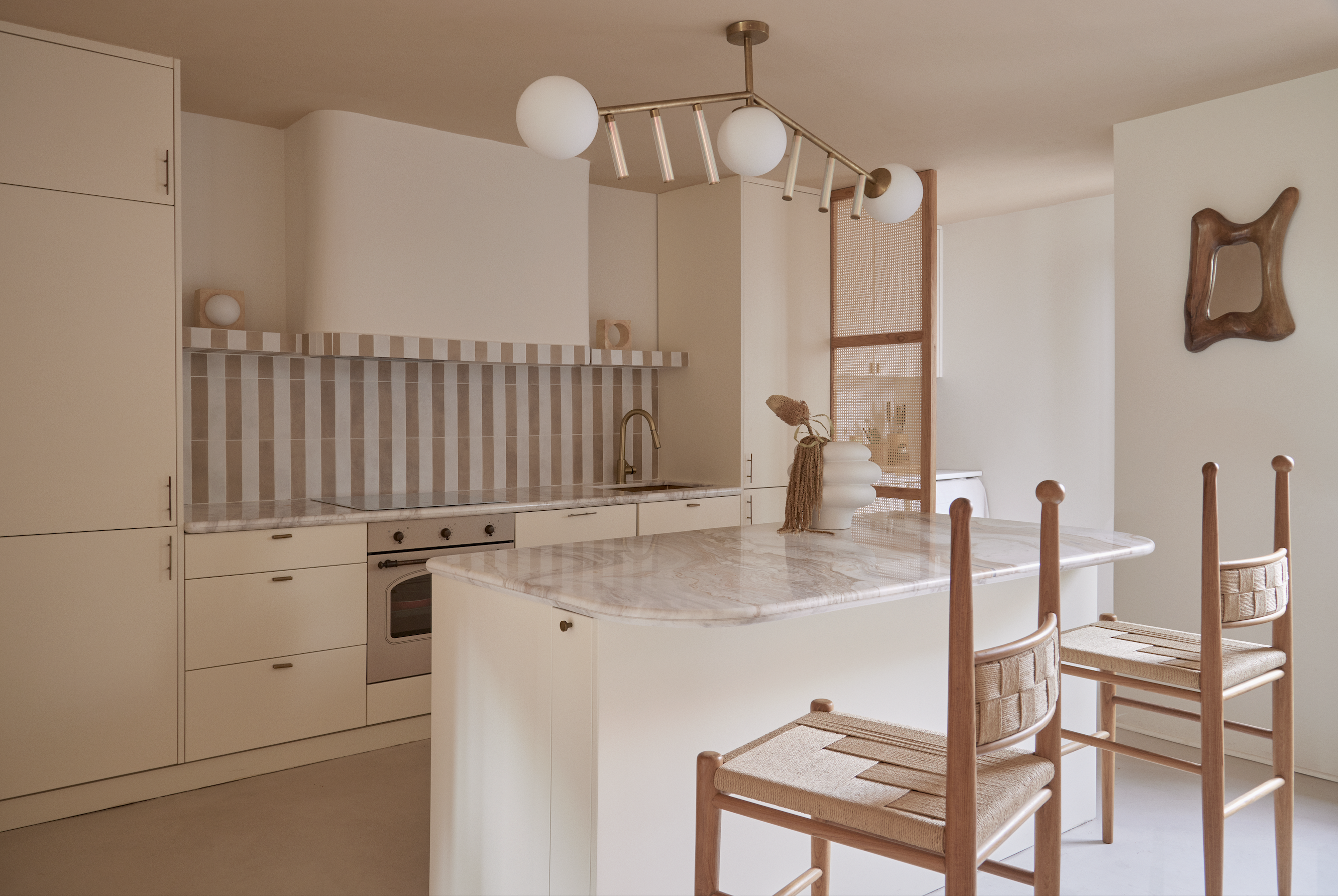 A kitchen awash in soft, pink tones