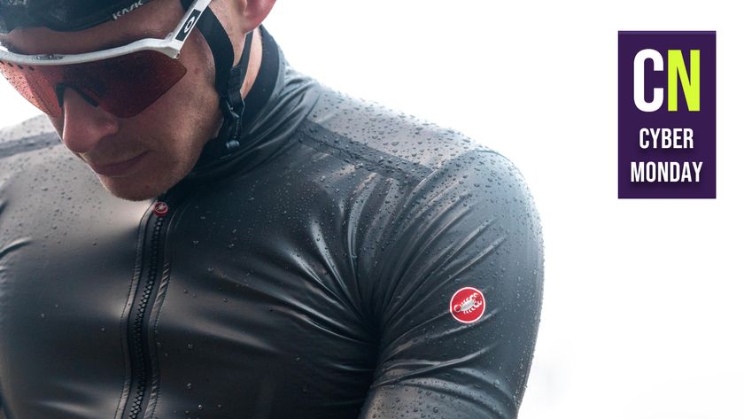 A cyclist in a Castelli jacket in the rain, with a Cyber Monday badge overlaid