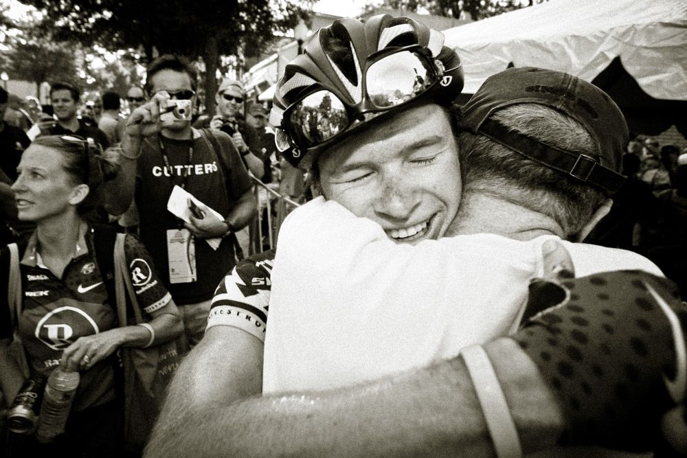 Ben King hugs his dad after winning the 2010 US pro road race championship.