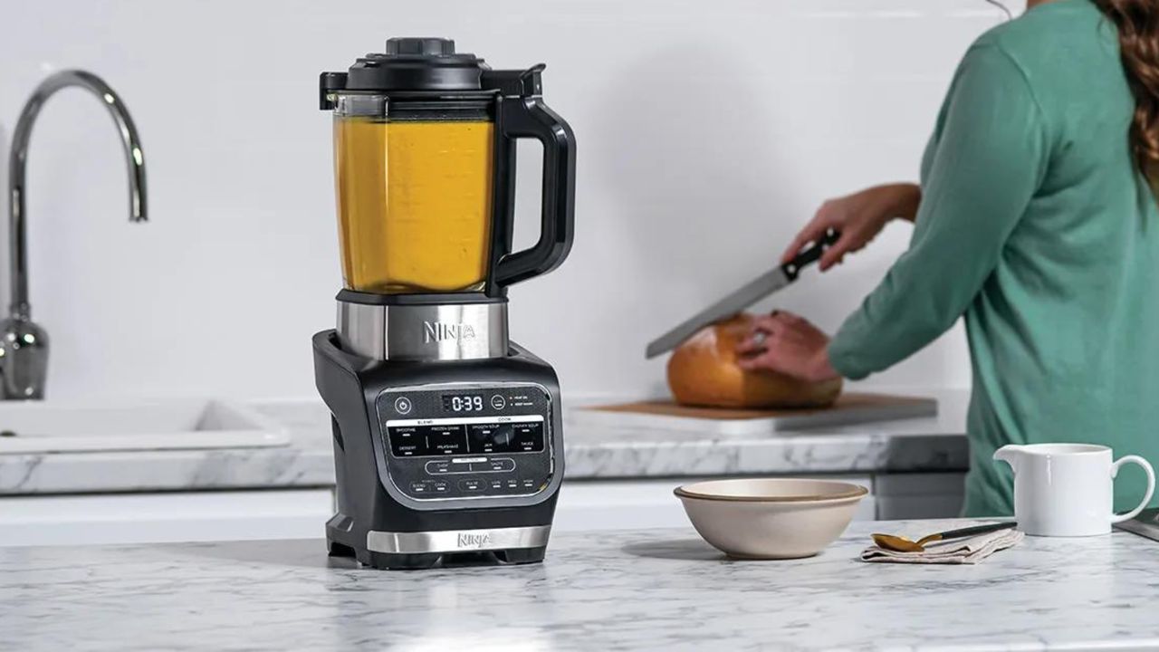 Ninja Foodi Blender &amp; Soup Maker in modern kitchen on white marbled countertop