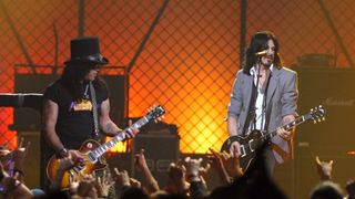 Slash and Gilby Clarke onstage in 2006