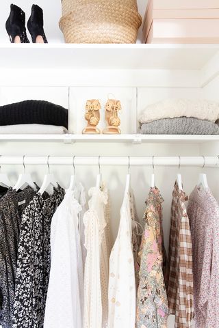 Clean and organized closet with shoes, clothes, and purses