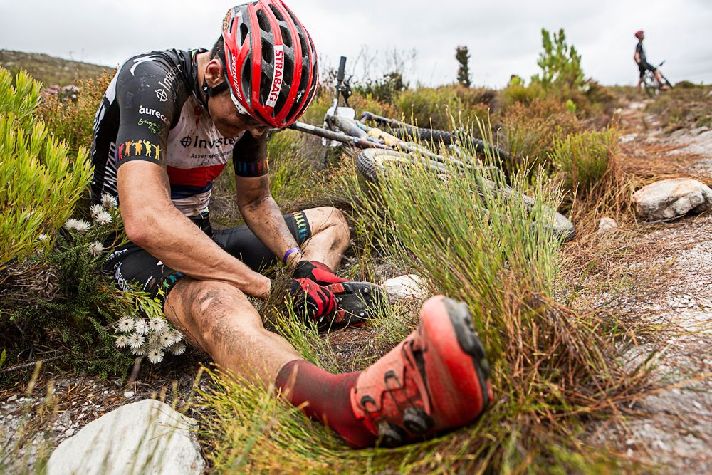 Jaroslav Kulhavy adjusts his cleats during stage 1 of the 2019 Absa Cape Epic Mountain Bike stage race