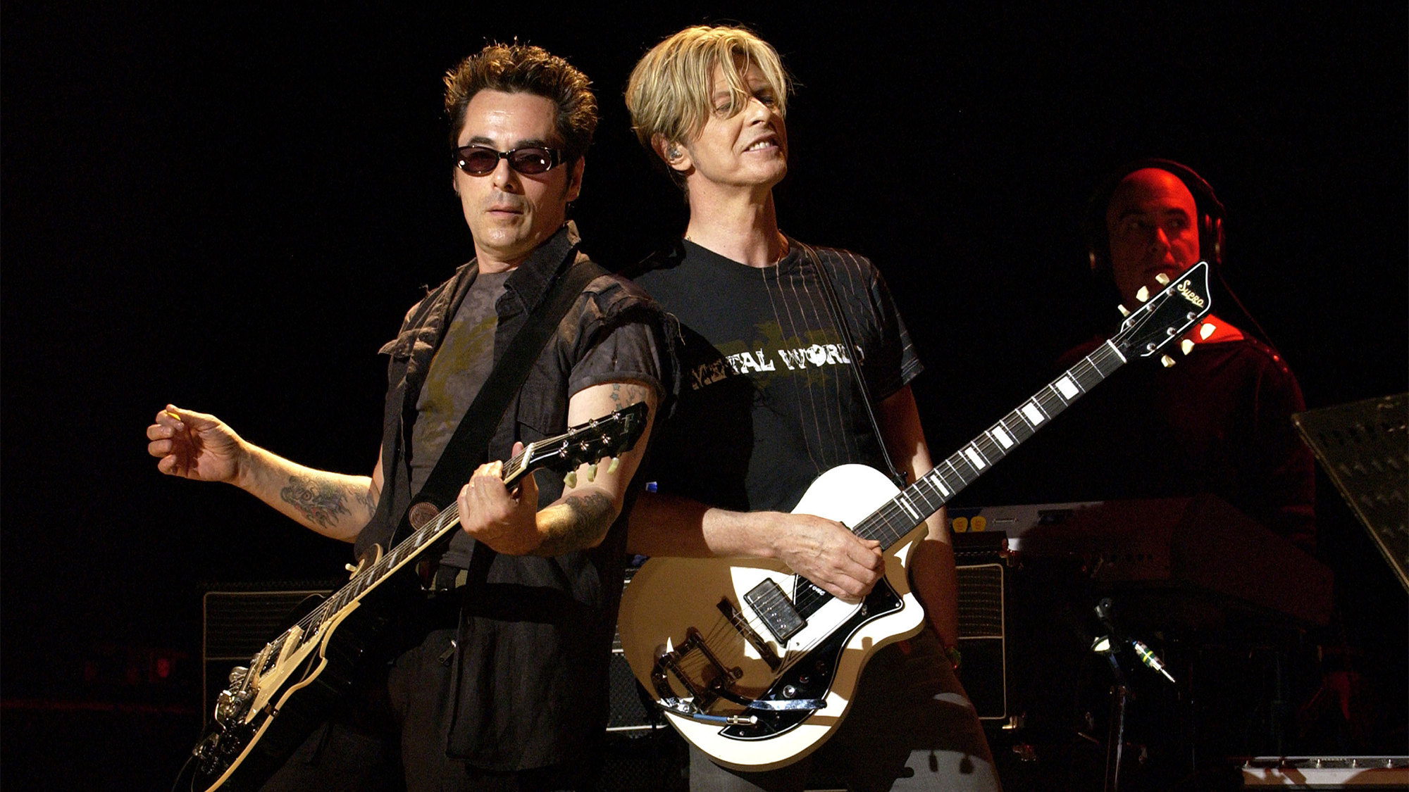 Earl Slick and David Bowie during David Bowie Gives Fans a Strong Dose of &quot;A Reality Tour&quot; at Special Poughkeepsie Warm Up Show For His Upcoming World Tour at The Chance Nghtclub in Poughkeepsie, New York, United States.