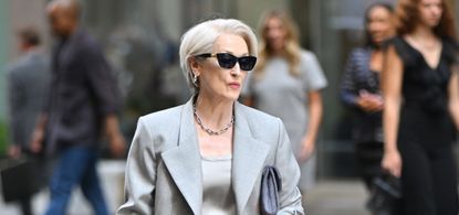 Meryl Streep filming Devil Wears Prada 2 wearing a grey blazer and top