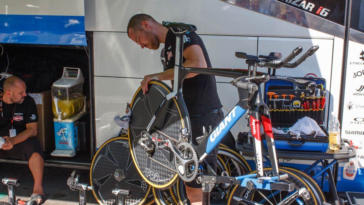 The last thing you want in a TT is a puncture, so this mechanic was wiping tyres clean of debris (Matthew Allen / Immediate Media)