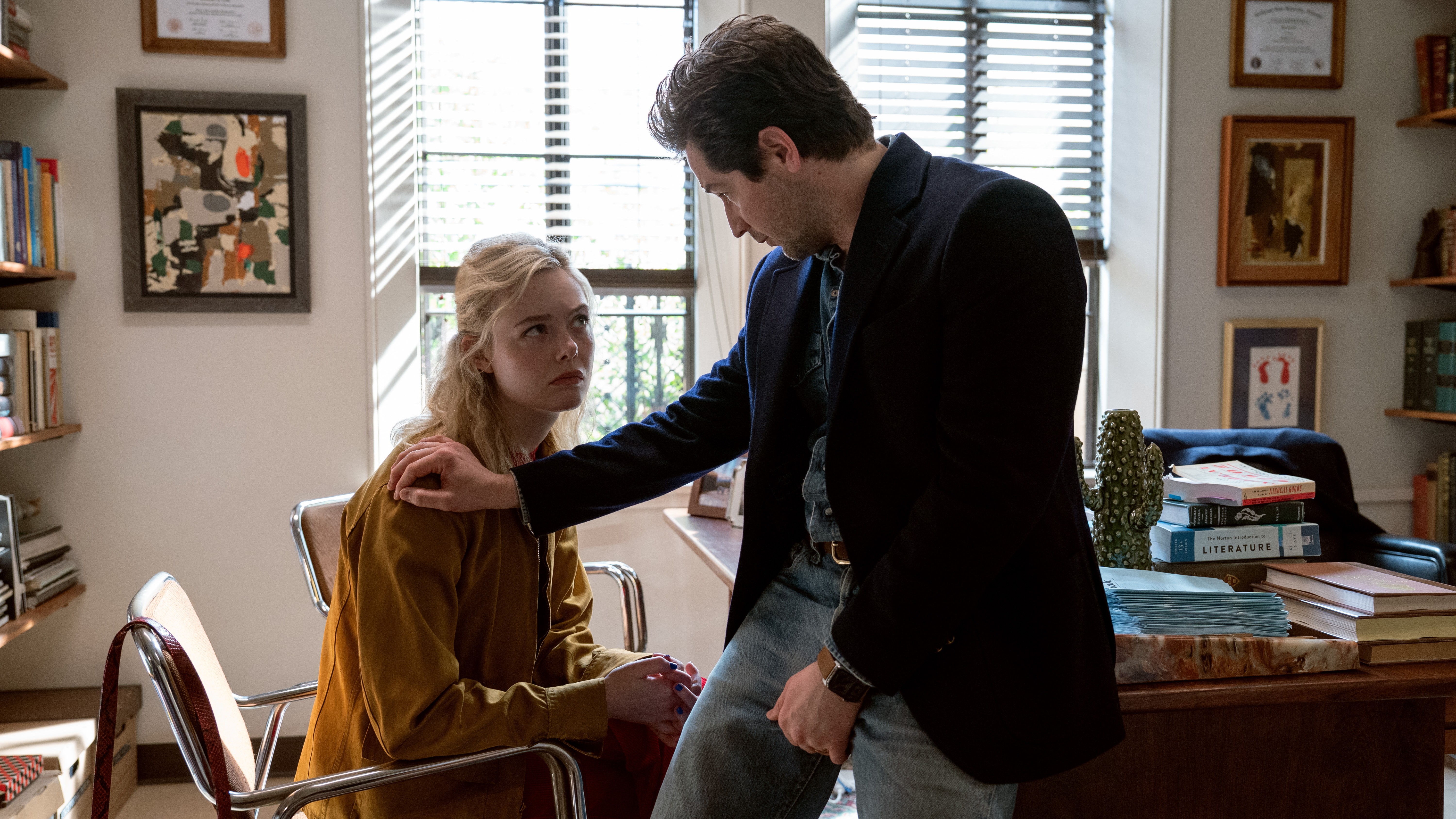 L-R: Margo (Elle Fanning) meets with her professor Mark (Michael Angarano) in his office in a scene from Apple TV's &amp;quot;Margo's Got Money Troubles&amp;quot;