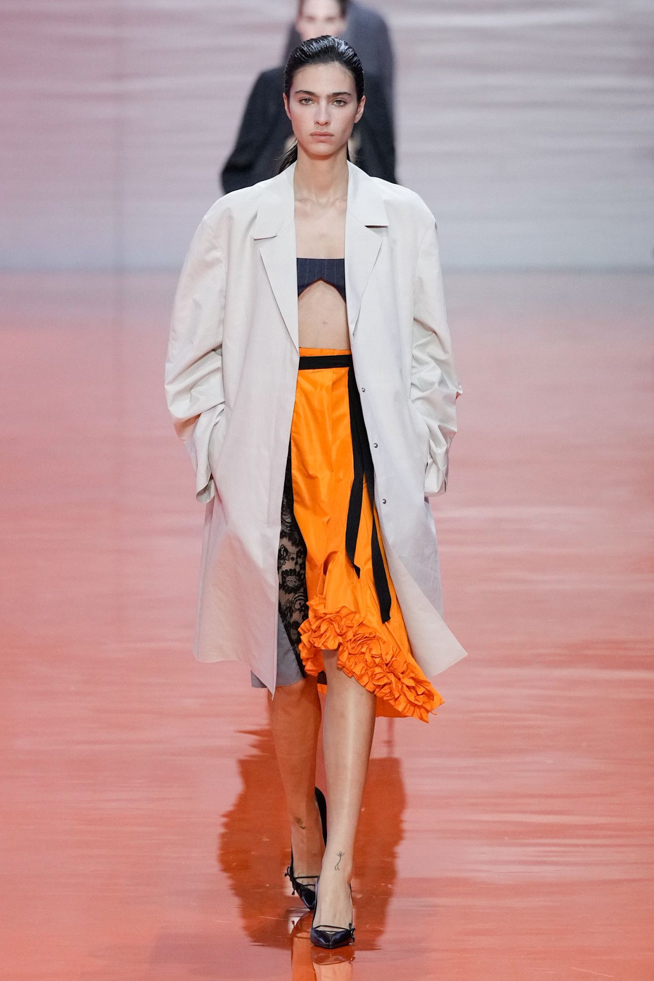 A Prada model wearing a Frankenstein skirt in the S/S 26 show.