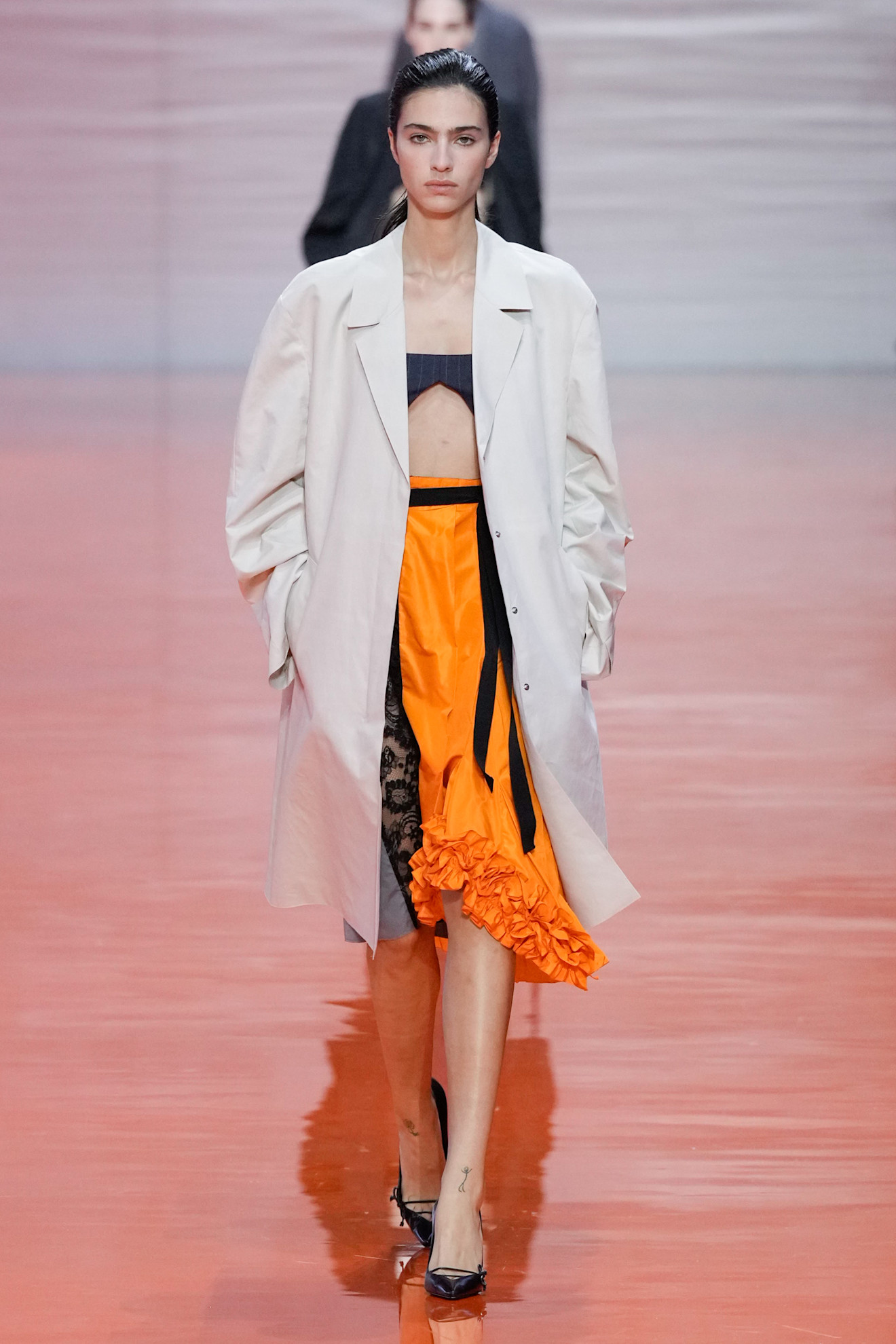 A Prada model wearing a Frankenstein skirt in the S/S 26 show.