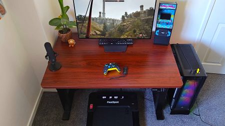 Flexispot Under Desk Treadmill under E7 plus desk with monitor on top and Oblivion Remastered running on gaming PC.
