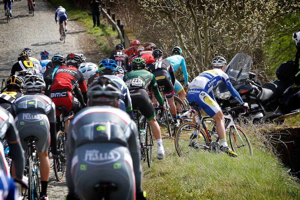 Riders head for the ditch to avoid a crash.