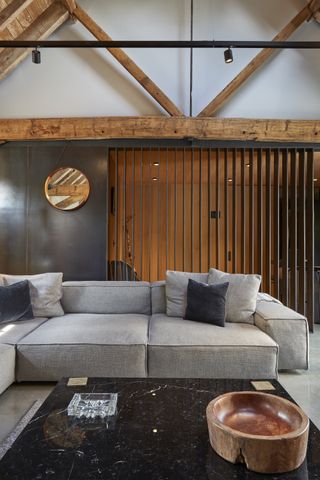 black steel wall cladding in barn conversion living room
