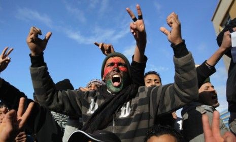 Rebels (pictured) have gained control of much of Eastern Libya, and the U.S. is reportedly concerned that Moammar Gadhafi would deploy chemical weapons on them before letting Tripoli fall.