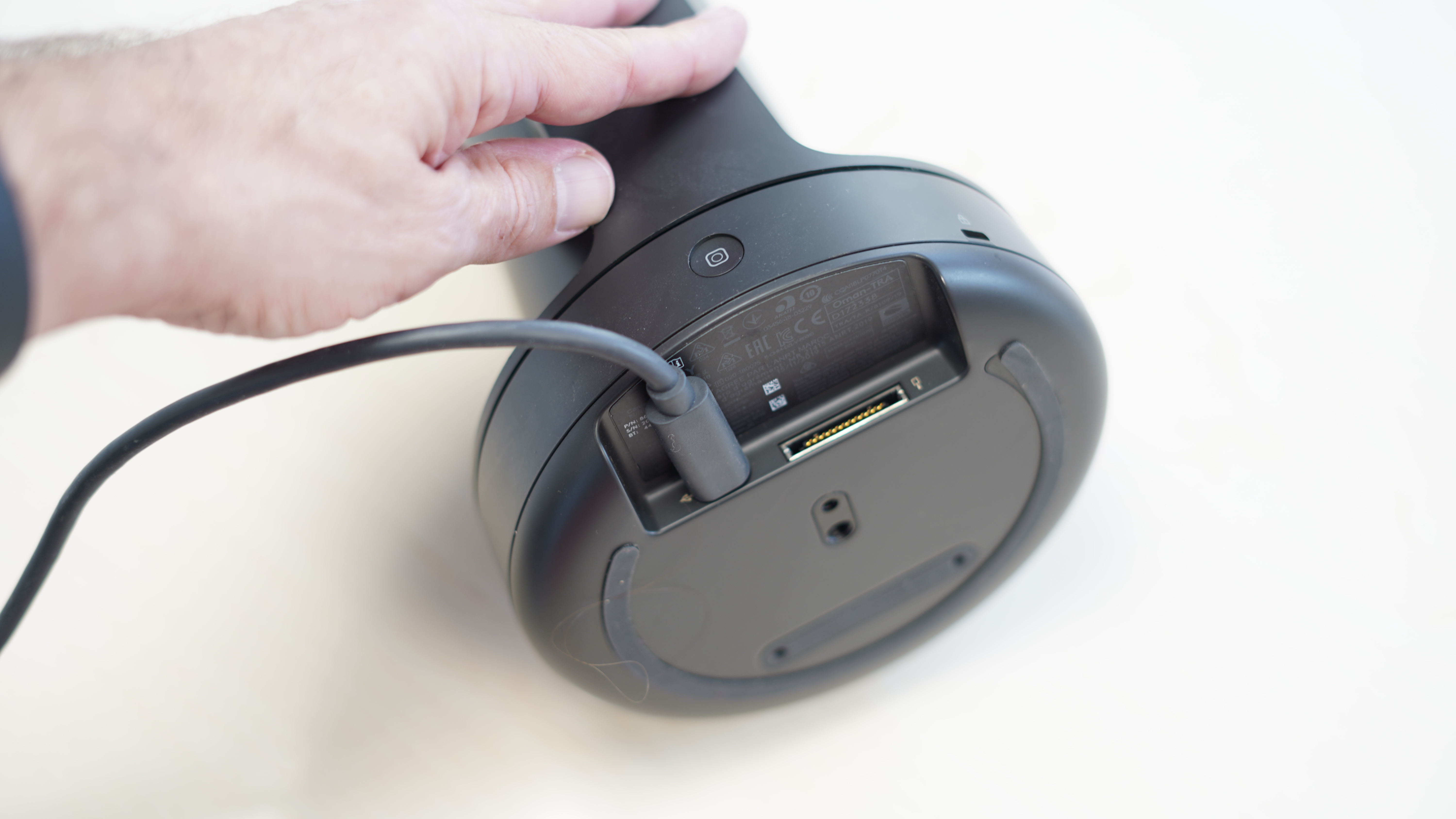 Logitech Rally base and a hand