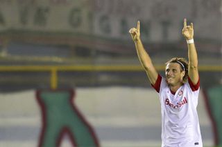 Diego Forlan celebrates a goal for Internacional against Fluminense in July 2013.