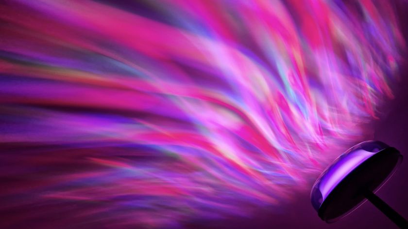 The Govee Uplighter Floor Lamp shines a multicoloured aurora effect onto a slanted ceiling.