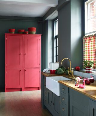 Kitchen pictures featuring a dark gray-green room with bright red painted pantry and gingham blinds.