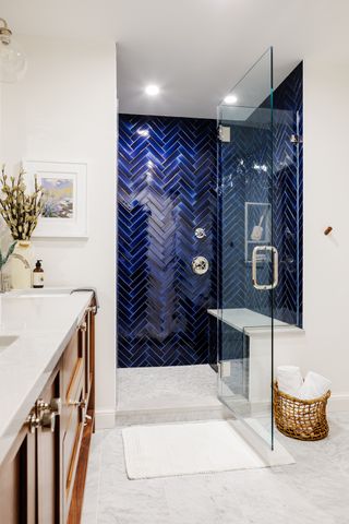 Bathroom by Four Brothers, Washtington D.C. with blue-tiled shower enclosure