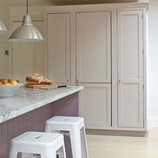 kitchen with marble worktop cabinet and hanging light