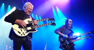 Alex Lifeson and Geddy Lee of Rush rock double-necks during a 2026 reunion show in LA.