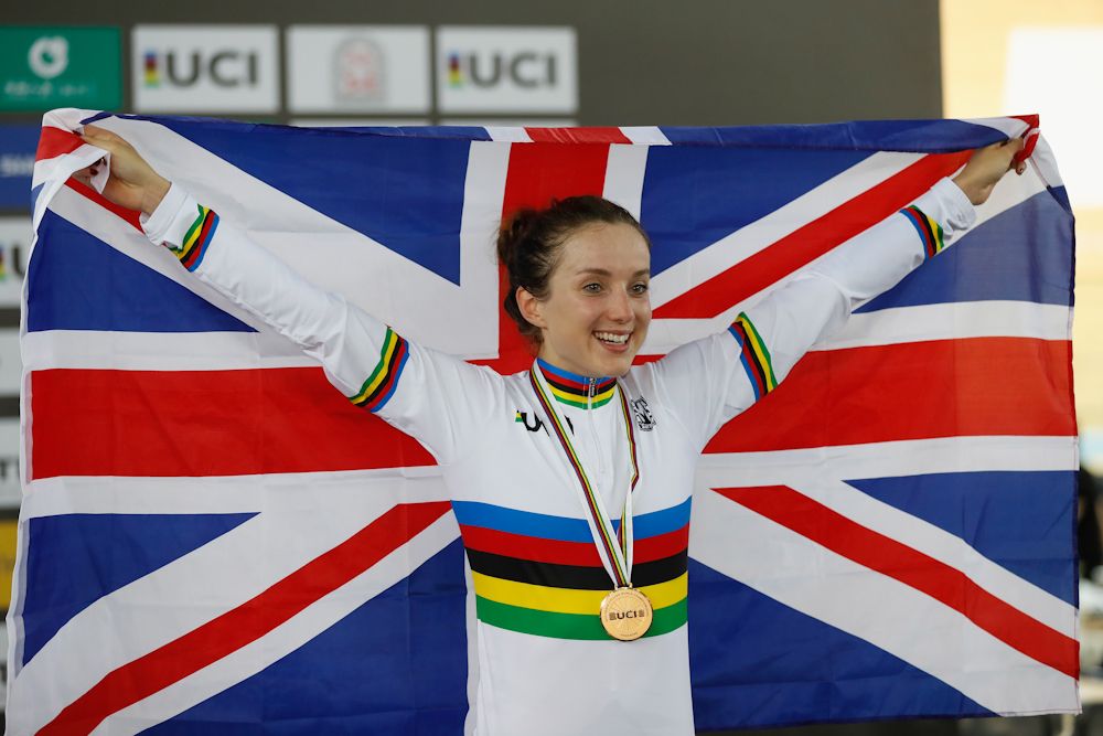 Elinor Barker of Great Britain poses with national flag after winning Women's Point Race Final on Day 5 in 2017 UCI Track Cycling World Championships