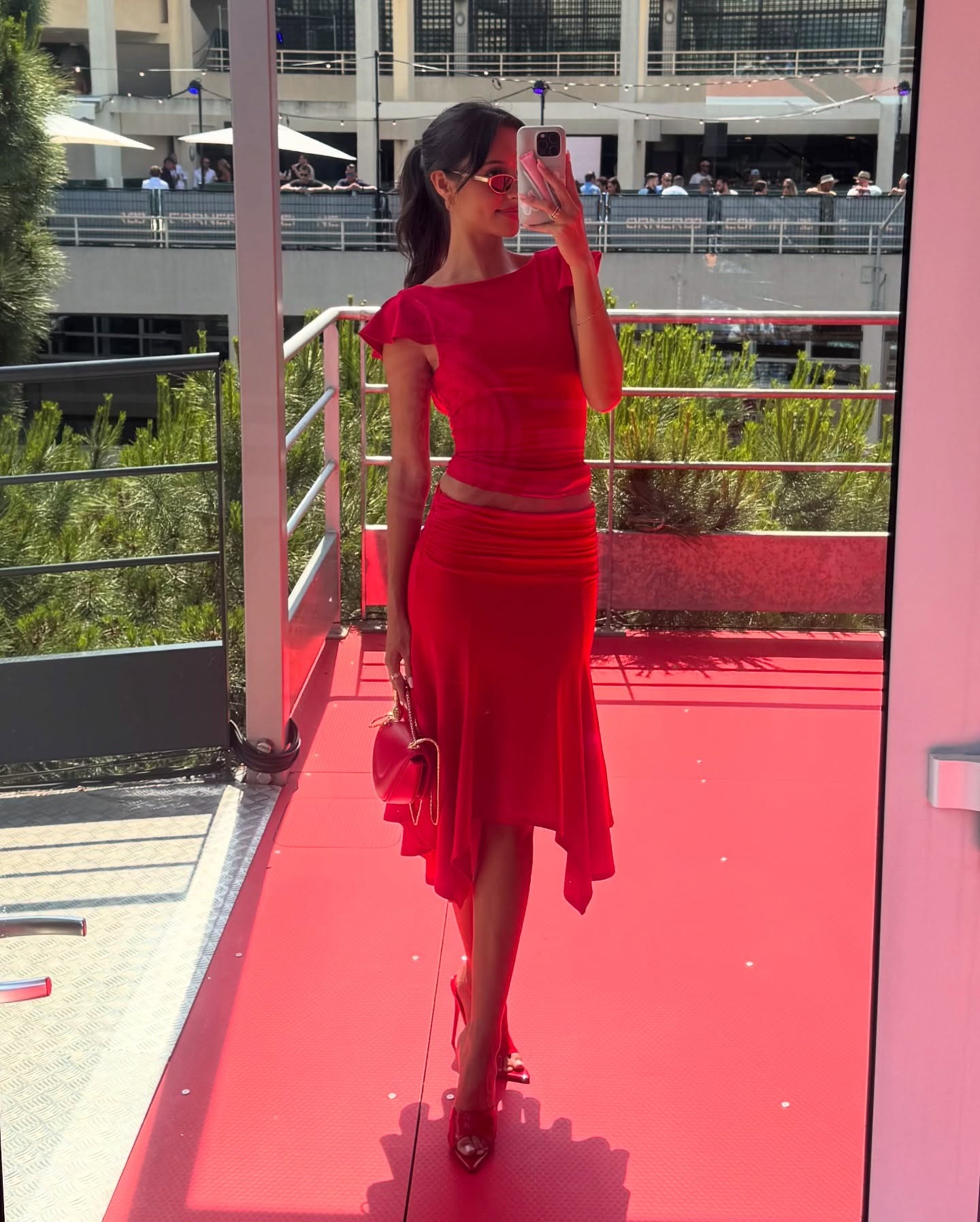 Formula 1 WAG wearing race day outfit.