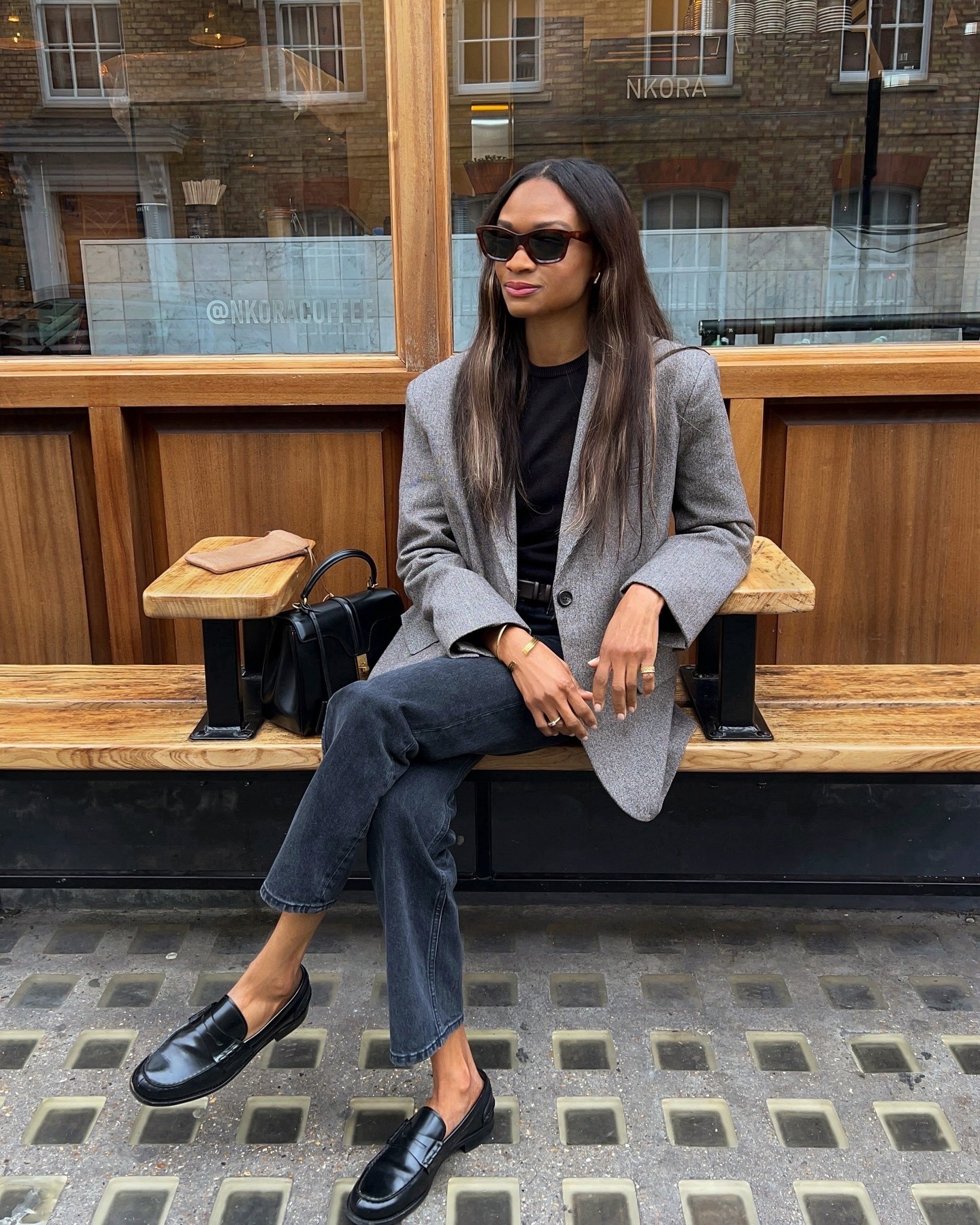 Woman wearing oversize blazer in street style shot.