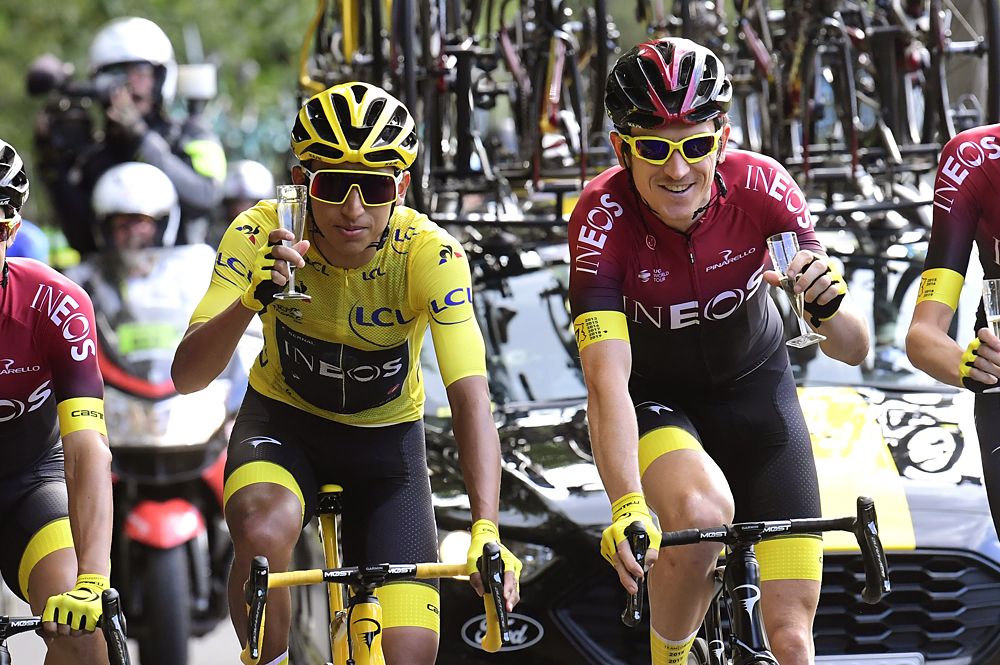 Egan Bernal (Team Ineos) and Geraint Thomas toast to victory at the Tour de France