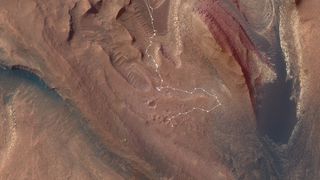 aerial map of mars with a white line representing the path taken by nasa's curiosity rover up a steep slope