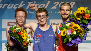 Matthew Phillips celebrates on the podium after winning the 2018 World Championship