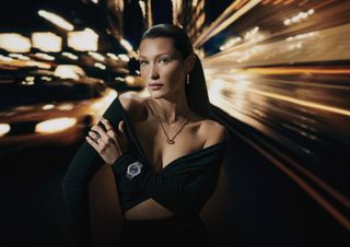 Bella Hadid poses wearing gold and silver jewelry in a Chopard campaign