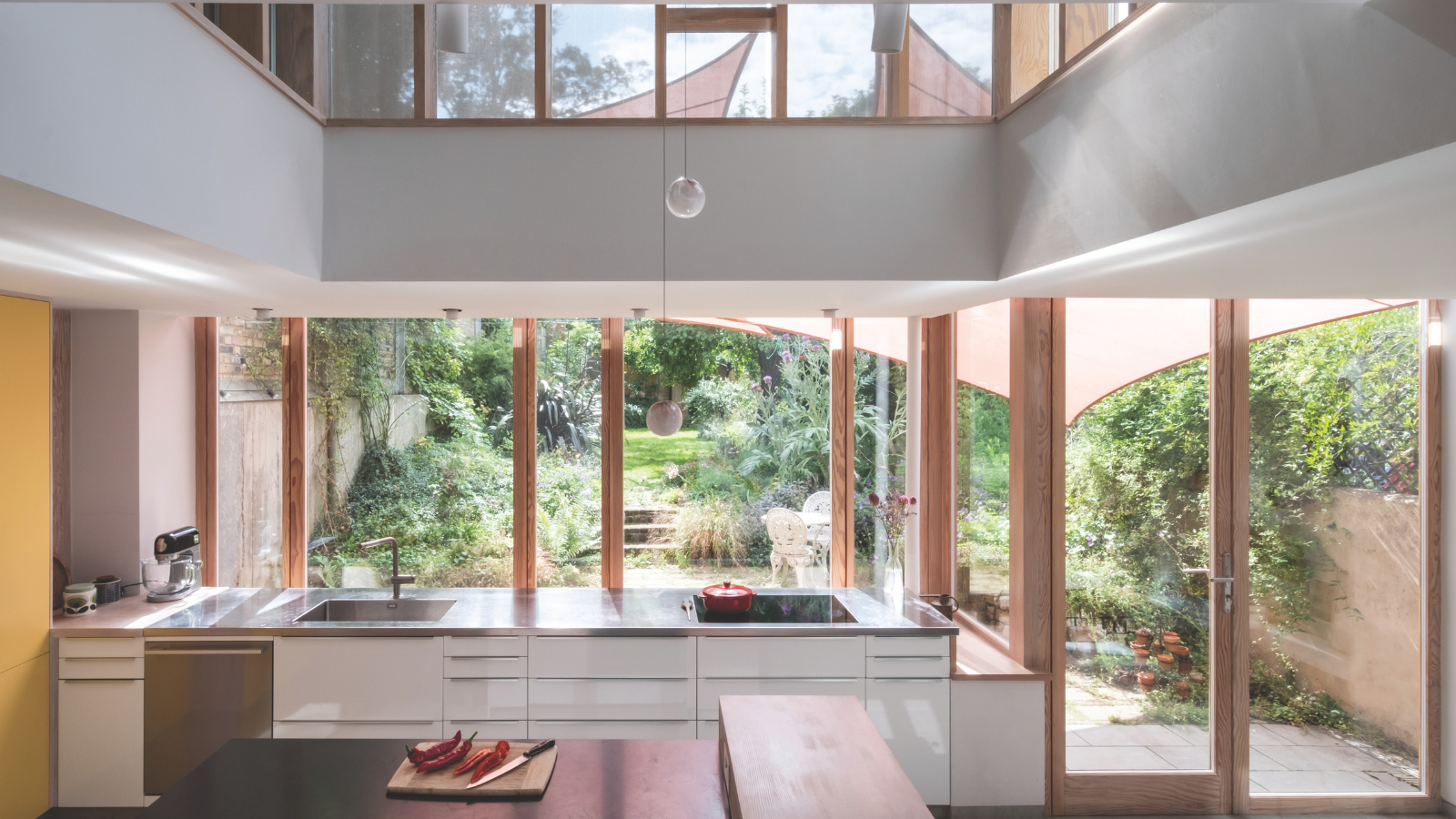 Inside the kitchen with windows overlooking the garden