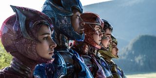 Power Rangers team with helmets open