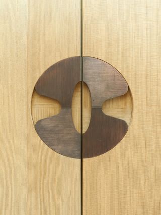 Oregon pine built-in closer doors, with custom-made door handles of copper, in a pattern drawn by artist and architect Katrine Skavlan.