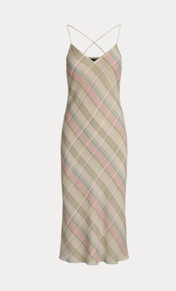 a plaid ralph lauren dress in front of a plain backdrop
