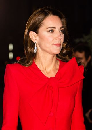 Kate Middleton wears a red dress as she attends the "Together at Christmas" community carol service