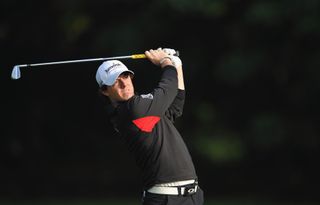 Rory McIlroy hits an iron shot in 2011