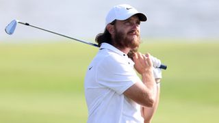 Tommy Fleetwood of England plays his second shot on the 17th hole during the third round of the Dubai Invitational at Dubai Creek Golf and Yacht Club