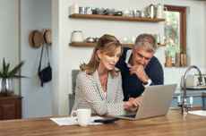 Older couple looking at laptop