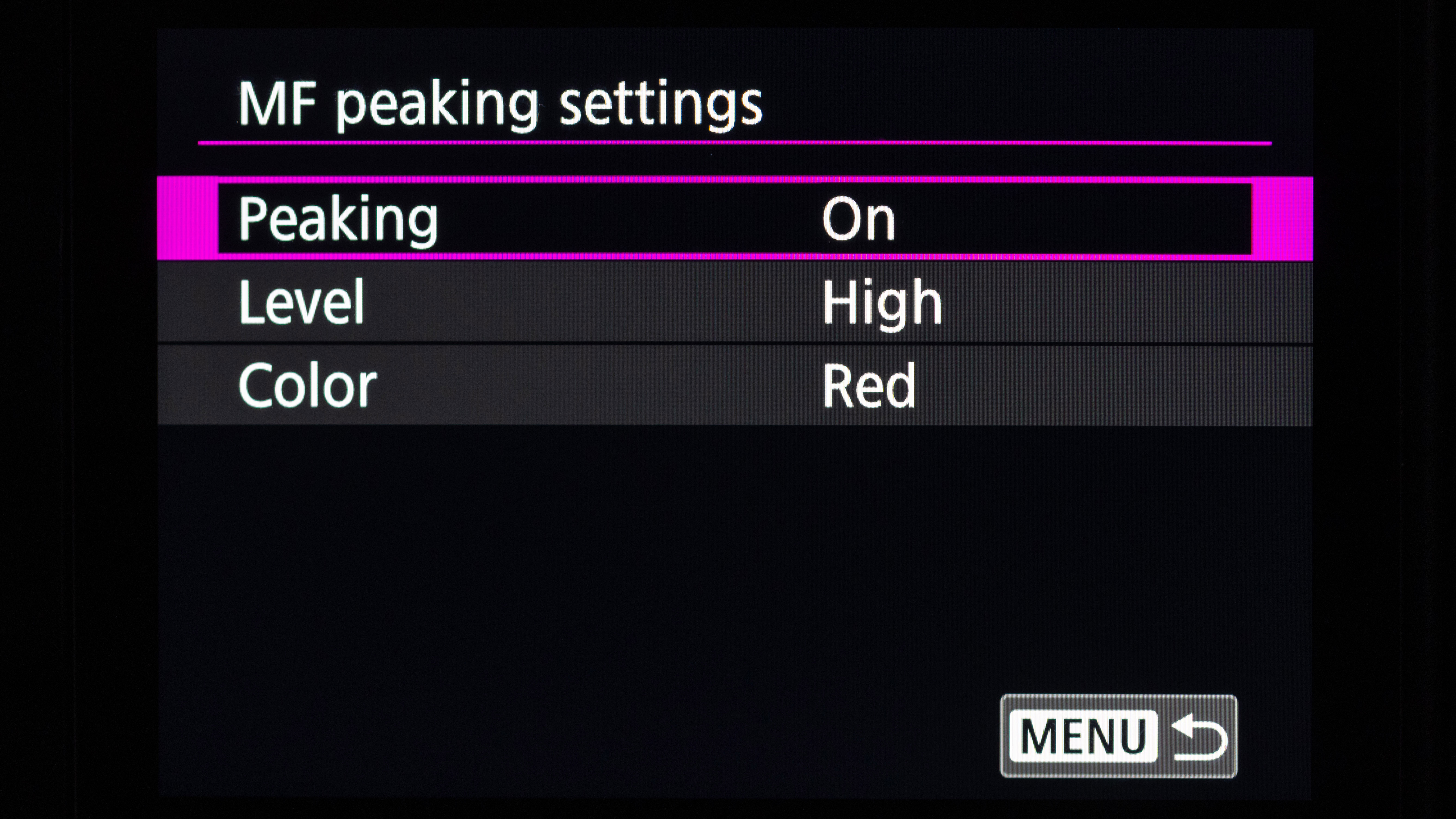A shot of the back of a Canon EOS camera showing the Focus Peaking menu