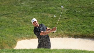 Brooks Koepka pitches out of a trap at the Memorial Tournament in July 2020. 