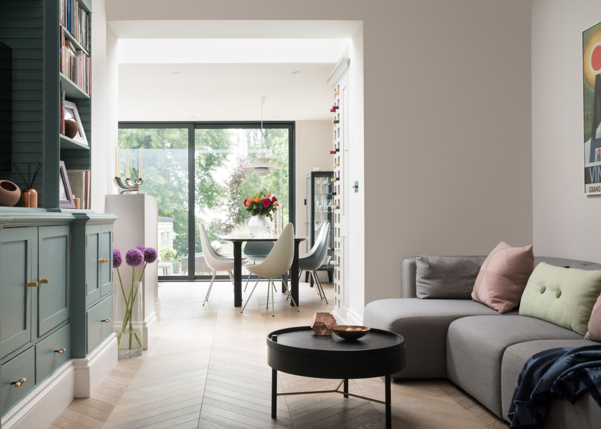 open-plan living and kitchen space with sliding glass doors