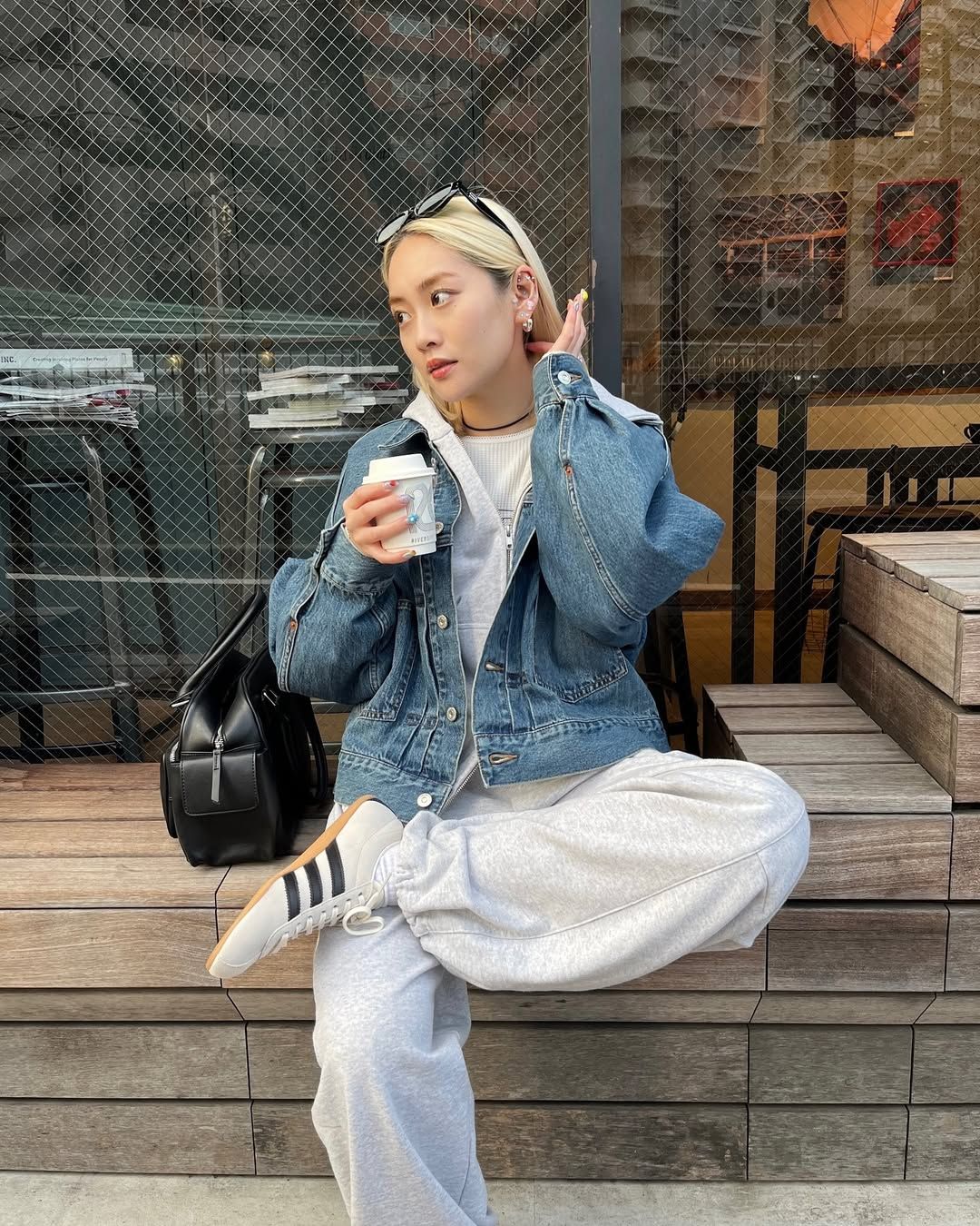 An influencer wearing adidas sneakers.