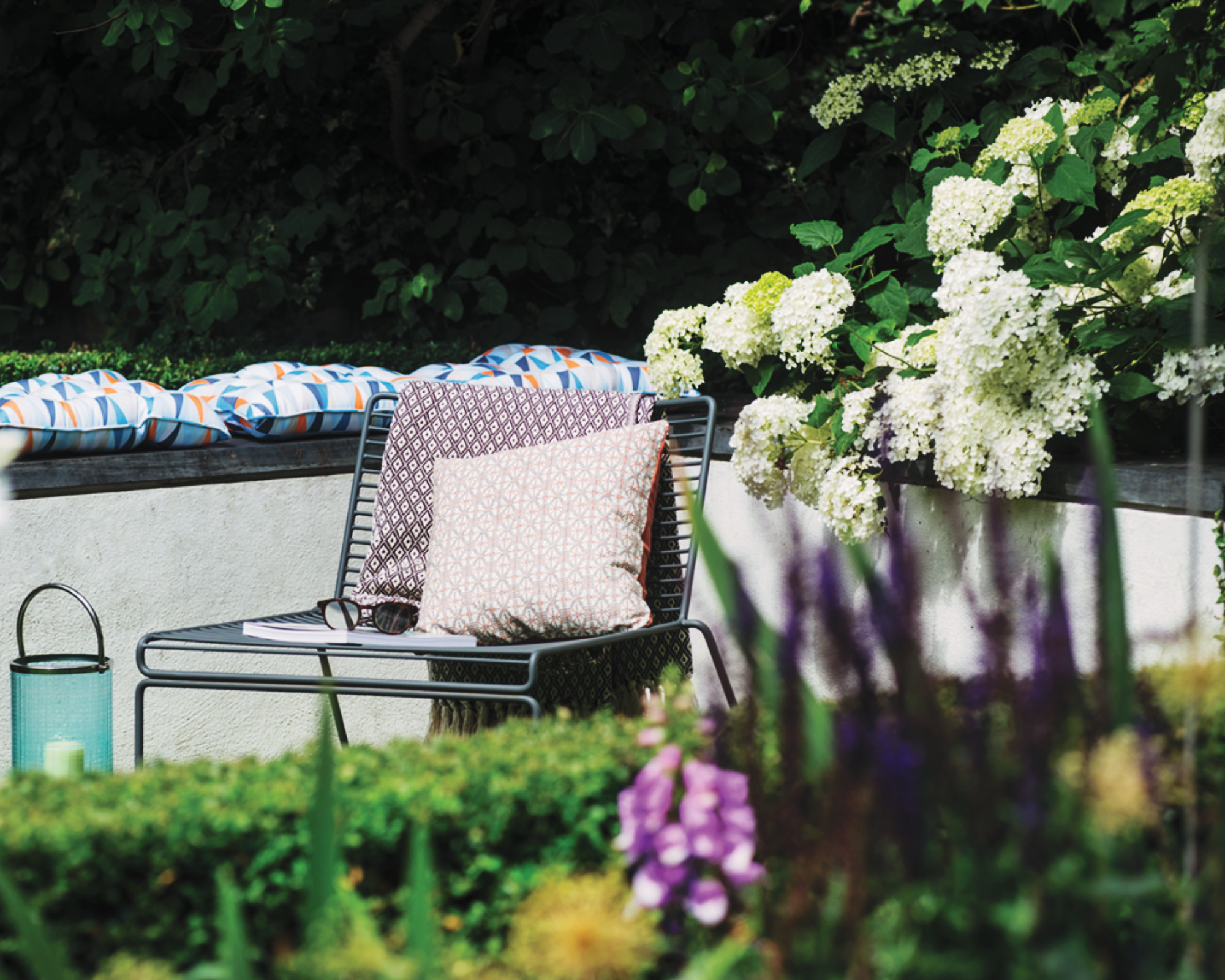 single chair and hydrangea in a modern garden